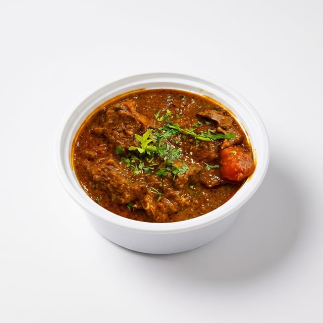 Chef’s Special Goat Curry – Traditional Bone-In Mutton Masala.